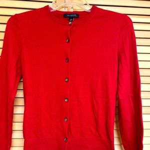 This is from the “Ann Taylor” cardigan shirt. Size XS